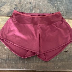 Womens Oiselle maroon running shorts.